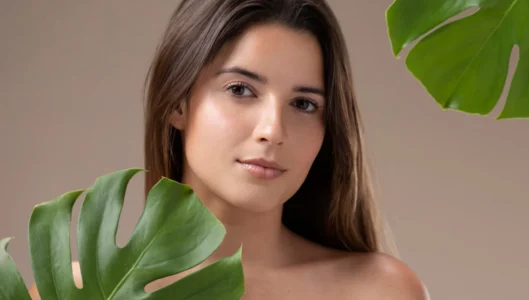 Woman with tropical leaves background